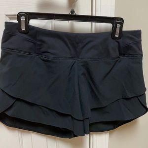 Black athletic shorts by Calia